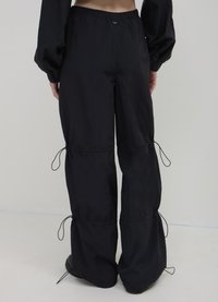 Calliope PALAZZO - Pantalon classique - ultrablack