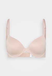 Beige underwire bra with smooth, padded cups, adjustable straps, and a cross-back design. Tag visible on the interior band.