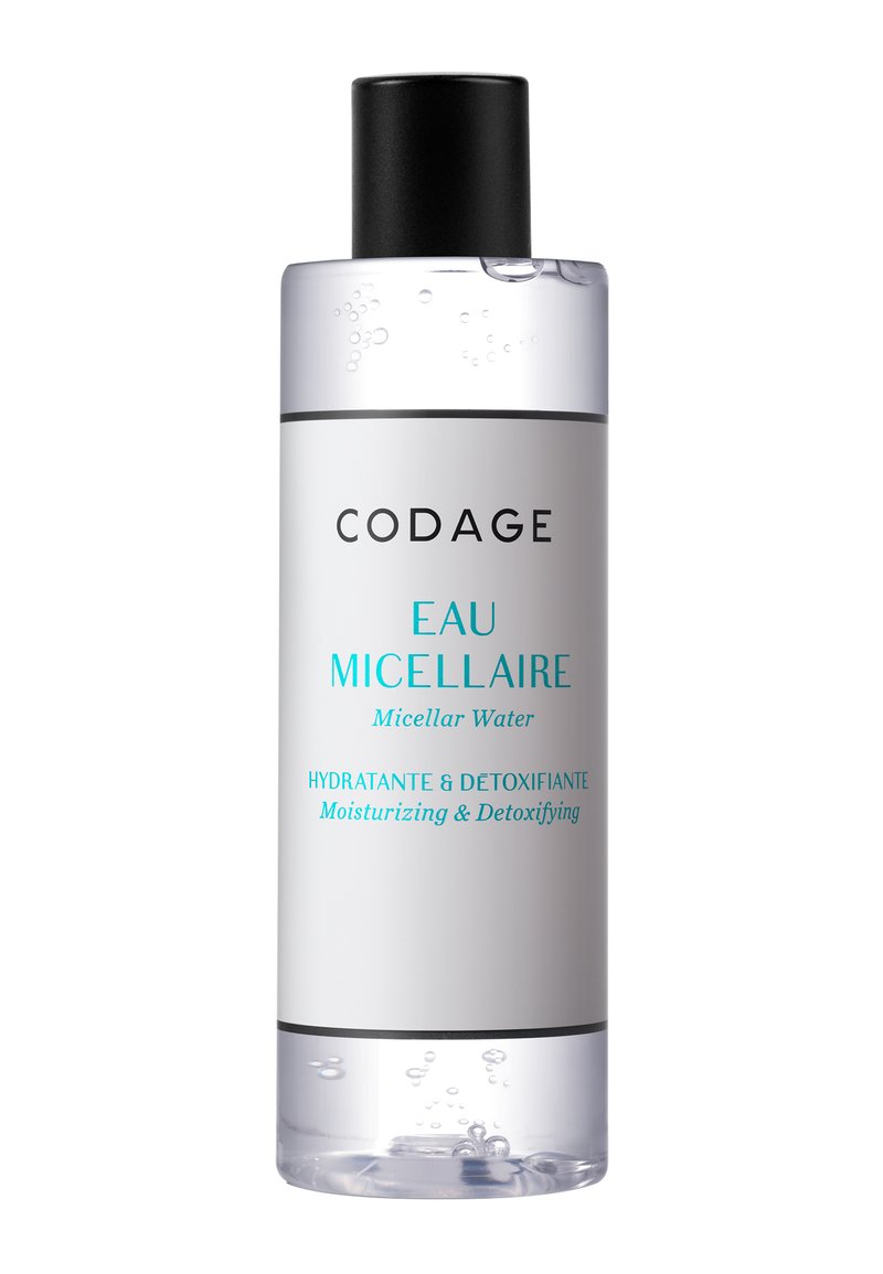 Transparent bottle of micellar water with a black cap, cylindrical shape, featuring a white label with black and turquoise text.