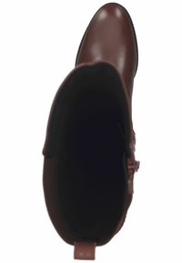 Bottines en cuir marron avec une surface lisse, un bout arrondi et des détails de couture. L'intérieur est doté d'une doublure douce noire.