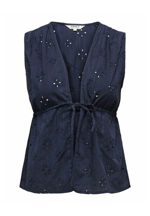 Top sin mangas de color marino con escote en V, que presenta recortes de broderie anglaise con motivos florales y un cinturón con lazo. Textura suave con un corte relajado.