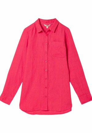 Vaaleanpunainen pellavapaita, jossa on pitkät hihat, nappilistalla edessä, terävä kaulus ja yksi rintatasku. Sileä pinta ja kevyt kangas.