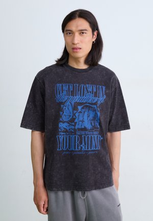 Black, oversized t-shirt with blue graphic text and illustrations. Cotton material, crew neck, short sleeves, faded texture.