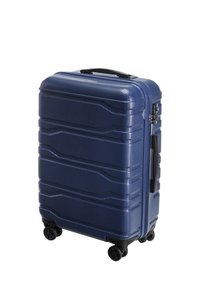 Valigia rigida di colore blu navy, con superficie strutturata, quattro ruote e maniglia laterale. Chiusura a zip con accenti di lucchetto di sicurezza.