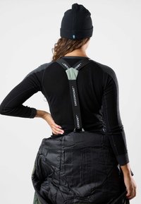 Black long-sleeve shirt with gray accents, featuring adjustable straps labeled "SWEDMOUNT," paired with a black puffy jacket underneath.