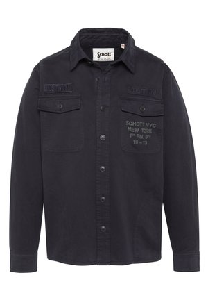 Zwarte blouse met lange mouwen en knopen, met borstzakken en geborduurde tekst "US 740N" en "Schott NYC New York 1st BN. 9th 19-13".