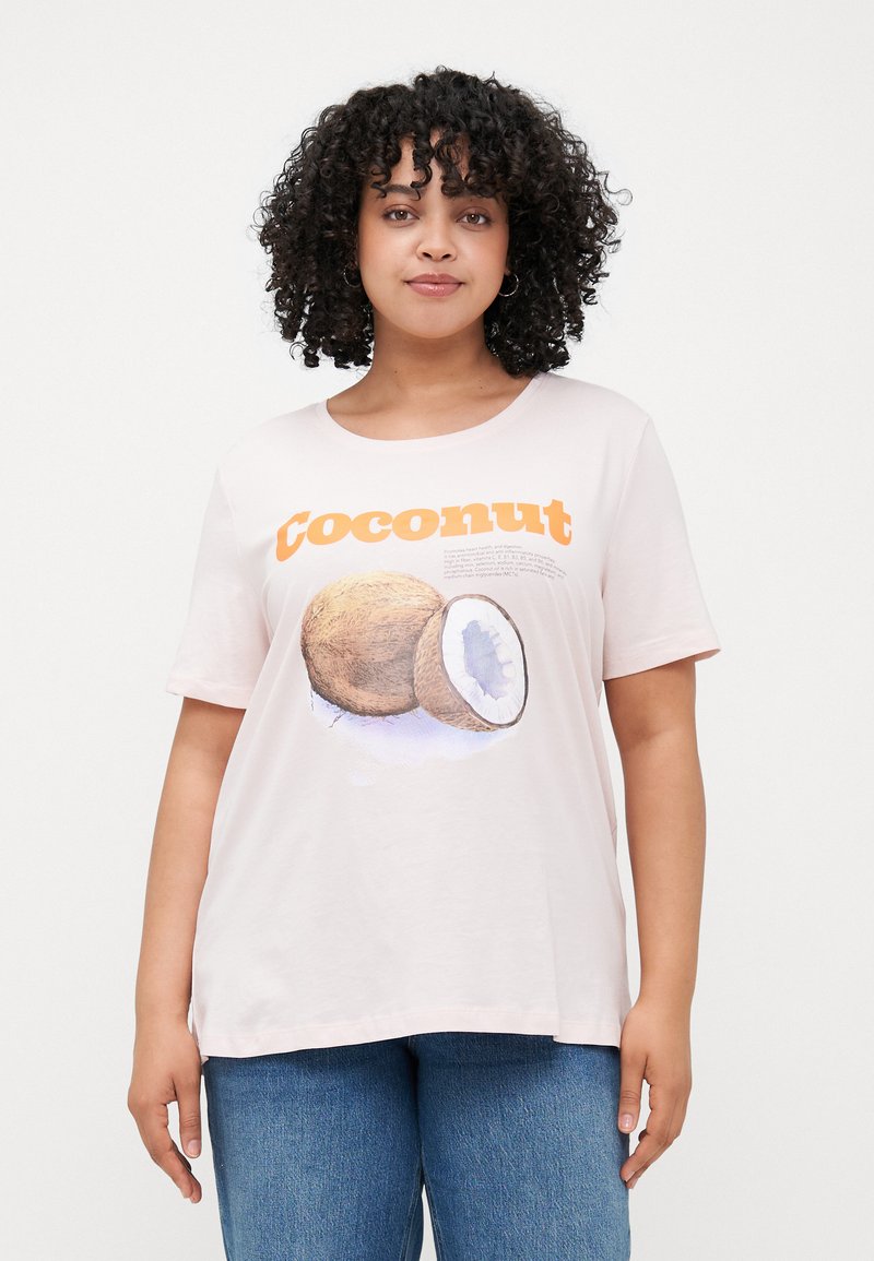 Light pink t-shirt with short sleeves, featuring an illustrated coconut graphic and orange text reading "Coconut." Soft cotton material.