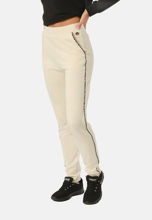 CON IMPUNTURE LEOPARDATE
 - Pantalones deportivos - allover leopard  beige