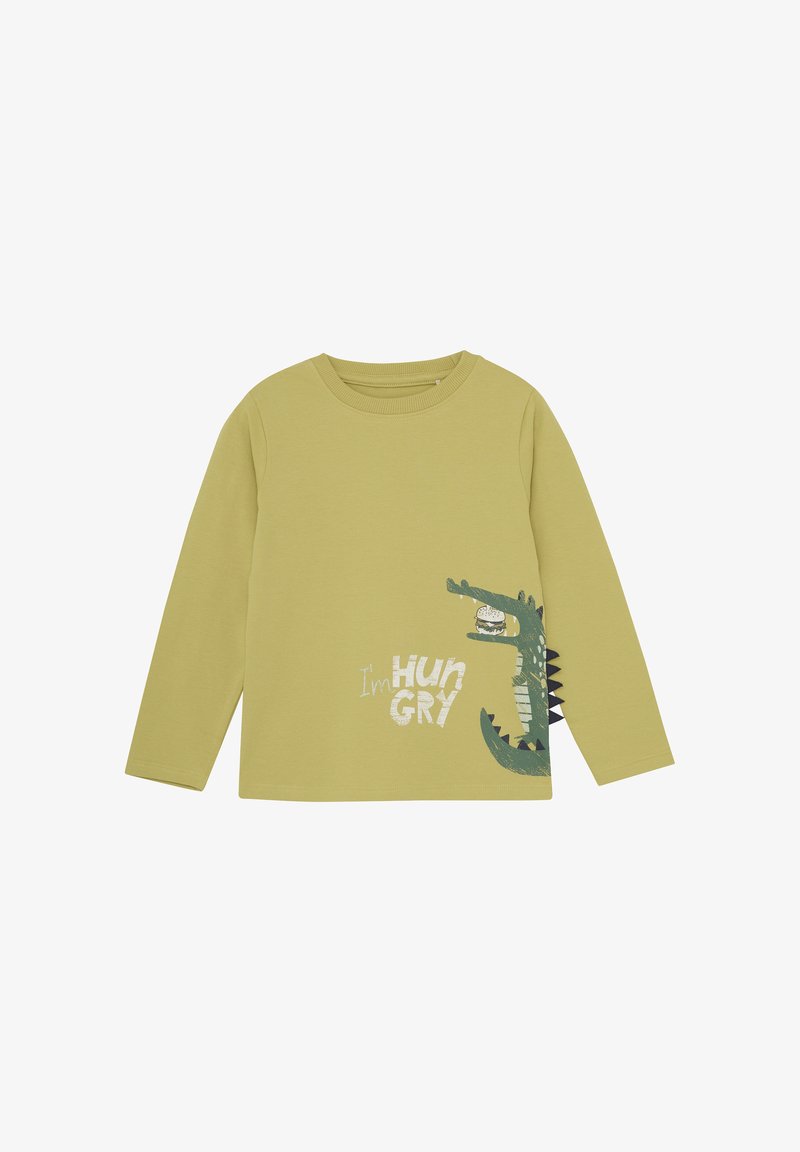 Camiseta de manga larga en algodón verde claro. Presenta un gráfico de un cocodrilo con el texto "Tengo HAMBRE" y espinas negras a lo largo del costado.