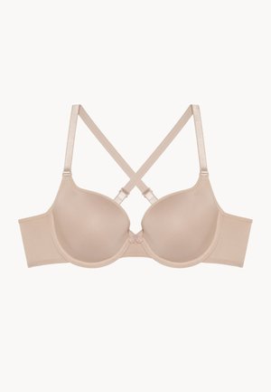 Beige push-up bra with smooth, padded cups, satin straps, and a decorative bow at the center. Features a wide band and crisscross strap design.