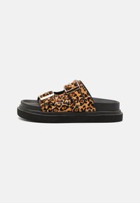 Leopard-print slide sandals with dual straps, gold hardware, and a black rubber sole. Soft textile upper and flat design.