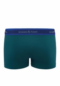 Męskie bokserki w ciemnoniebieskim kolorze z niebieską elastyczną talią, na której znajduje się napis "stoki i miasto" w jasnoszarym kolorze. Gładka tekstura, bez wzorów.