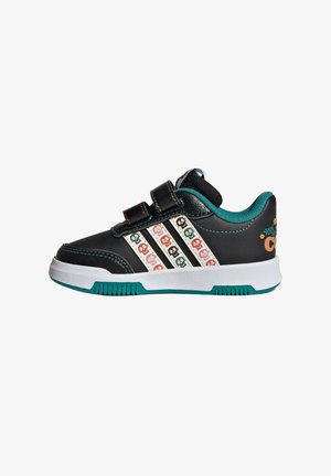 Scarpa da bambino nera con fodera turchese, suola bianca, motivi di teschi sulle strisce e due cinturini neri in velcro su sfondo bianco.