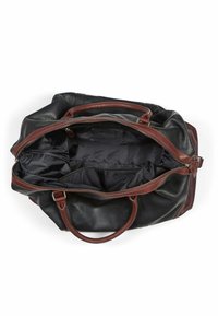 Black leather duffel bag with brown leather handles, zip closure, and a spacious interior lined in black fabric, featuring multiple pockets.