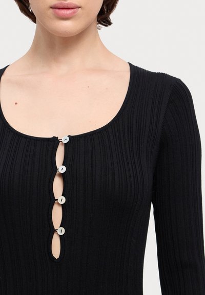 Black ribbed long-sleeve top featuring a scoop neckline and five decorative buttons along the front, with a subtle texture.
