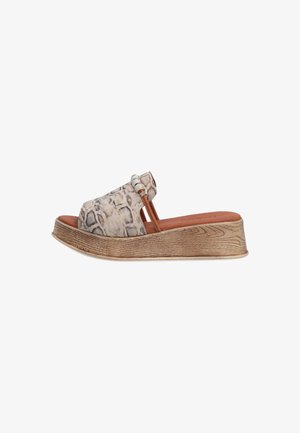 Textured snake-print slide sandal in beige and brown with a platform sole, featuring a wide band and subtle decorative hardware accents.