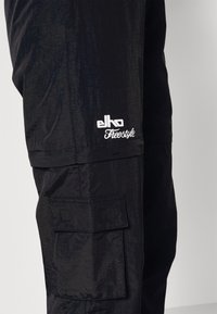 ELHO SIRMIONE - Trainingsbroek - black