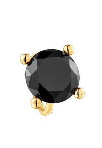 Anillo de piedra facetada negra con engaste dorado. La piedra es redonda y prominente, sujeta por tres detalles dorados. Banda dorada lisa.