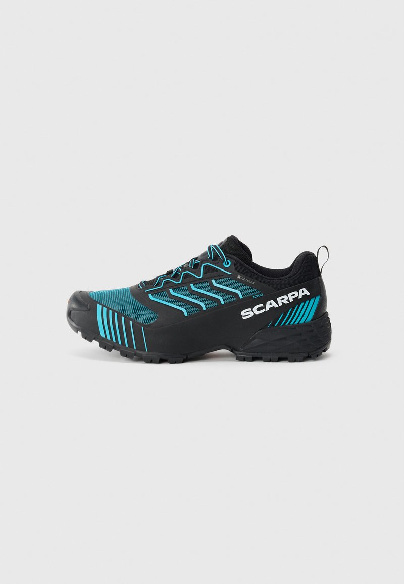 Trail running shoe with a black synthetic upper, turquoise accents, and durable rubber sole featuring a textured tread pattern.
