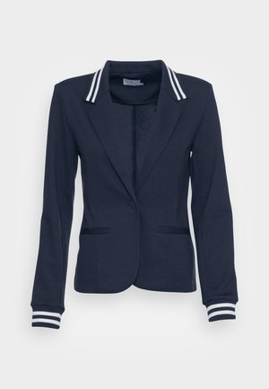 Blazer blu navy con dettagli a righe bianche sul colletto e sui polsini. Realizzato in tessuto morbido con una vestibilità su misura e due tasche frontali.