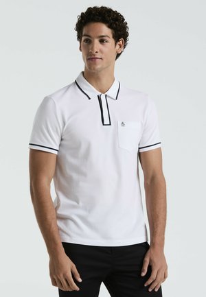Witte polo shirt van katoen, met een zwart afgewerkt kraag en mouwen, een borstzak en een logo op de borst.