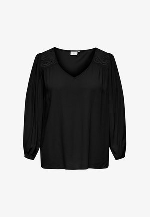 Melna blūze ar V veida izgriezumu un uzpuffetām garām piedurknēm. Raksturīga mežģīņu detaļas uz pleciem, gluda tekstūra un brīva piegriezuma.