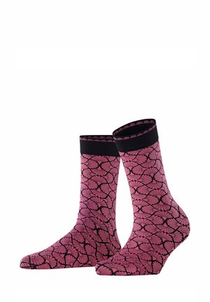 Rosa Socken mit Muster und einem schwarzen Blumenmotiv, die einen einfarbigen schwarzen Bund haben. Hergestellt aus weichem, strukturiertem Stoff, haben sie eine enganliegende Form.