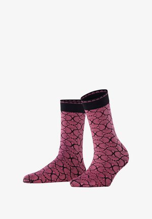 Pink patterned socks with a black floral design, featuring a solid black cuff. Made of soft, textured fabric, they have a fitted shape.