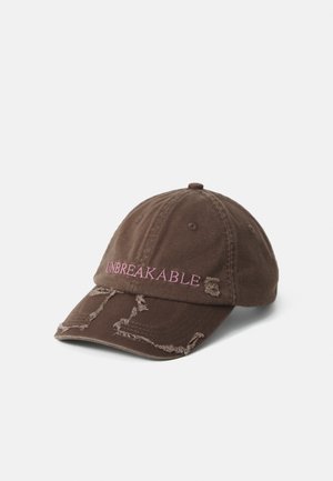 Brown distressed baseball cap with pink embroidered word "UNBREAKABLE" on front panel, placed on white background.