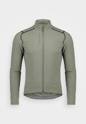 Hellolivgrüne langärmelige Radjacke mit durchgehendem Frontreißverschluss, erhöhtem Kragen und dezenten schwarzen Nahtakzenten an den Schultern.