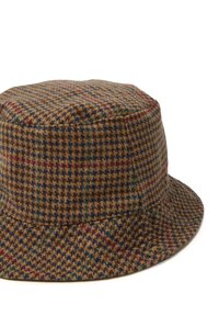 Sombrero tipo bucket marrón hecho de un tejido texturizado que presenta un patrón houndstooth en tonos marrones, azules, verdes y rojos. Corona redonda y ala ancha.