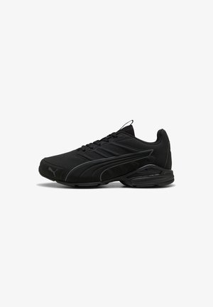 Black low-top athletic sneaker with lace-up front, sleek design, cushioned sole, and Puma logo on toe and side.