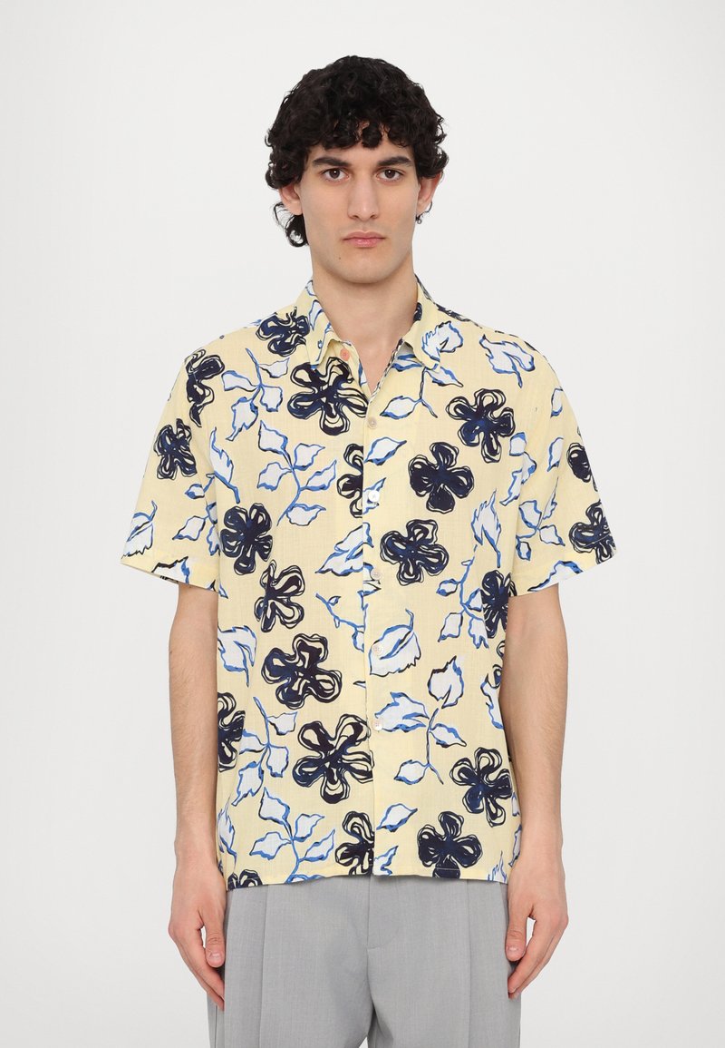 Short-sleeve, button-up shirt in yellow with a floral pattern. Features black and blue floral designs against a light background.