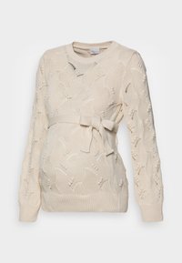 Sweter ciążowy w kolorze kremowym z teksturowanym wzorem dzianiny i kwiatowymi motywami, z paskiem do wiązania w talii oraz prążkowanymi mankietami.