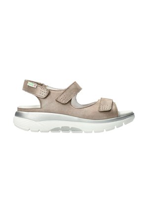 Sandale en tissu marron avec deux sangles ajustables à Velcro, design à bout ouvert, une semelle intermédiaire rembourrée et une semelle extérieure blanche texturée.