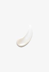 Witte keramieken lepel met een gladde, gebogen vorm en een glanzende afwerking. Heeft een ondiepe kom en een taps toelopende handgreep voor gemakkelijk vastpakken.