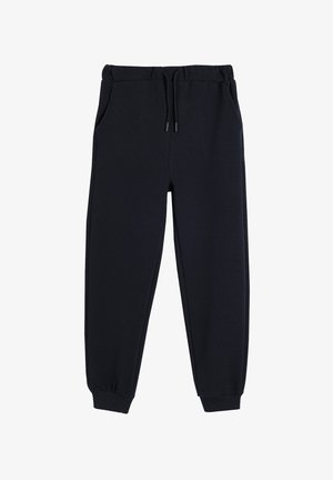 Pantalones de chándal negros ajustados con cinturilla elástica, cordón y bolsillos laterales. La tela tiene un sutil patrón texturizado.