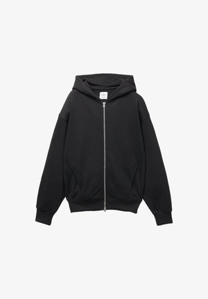 Schwarze Zip-Hoodie aus einer weichen Baumwollmischung, mit Kapuze, gerippten Bündchen und großen Seitentaschen in lockerer Passform.