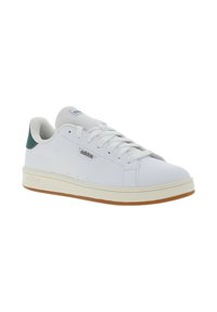 Scarpe da ginnastica bianche con una parte superiore sintetica liscia, punta tonda, suola in gomma e un accento turchese sul tallone. Presentano una tradizionale allacciatura.