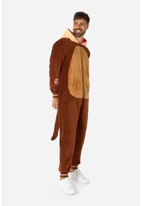 Tuta in peluche marrone con un pannello beige sul pancione, cappuccio, tasca a marsupio e polsini a righe. Presenta una coda e chiusura anteriore con zip.