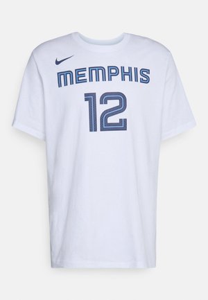 Bijela pamučna majica s natpisom "MEMPHIS" u plavom tekstu iznad broja "12", s Nike logotipom na lijevom ramenu. Kratki rukavi, opušteni kroj.