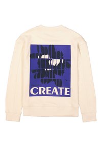 Sudadera color crema con un gran gráfico púrpura que presenta un diseño abstracto negro y el texto "Elige CREAR" en blanco. Textura suave.