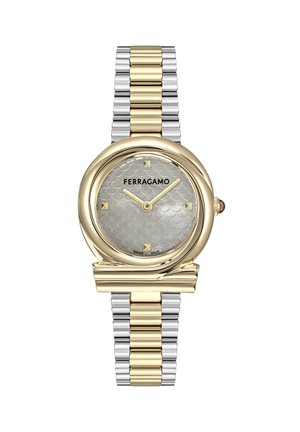 Gold and silver Ferragamo wristwatch with textured silver dial, gold hour markers and hands, and metal bracelet strap.