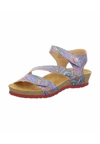 Colorful sandal with multicolored, wavy-patterned straps. Cork footbed, low wedge heel with a red outsole. Adjustable straps for fit.