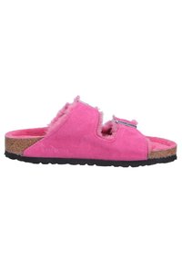 Pink suede slide sandal with a fuzzy lining, featuring two adjustable straps and a cork footbed. Black rubber outsole for grip.