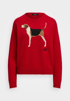 Piros kötött pulóver, amelyen egy álló kutya grafikai ábrázolása látható barna, fekete és fehér színekben. A bordázott mandzsetták és alj textúrát adnak.