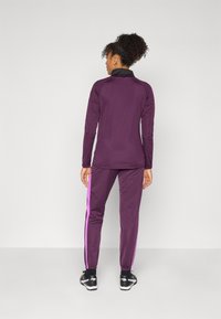 Puma INDIVIDUALBLAZE TRACKSUIT SET - Gornji dio trenirke - midnight plum/glowing red