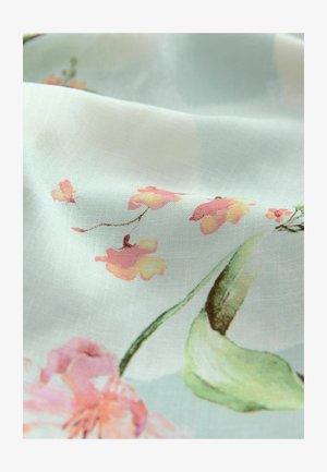 Light fabric featuring a floral pattern with pink and yellow blossoms on a soft blue background, with visible texture and translucent quality.
