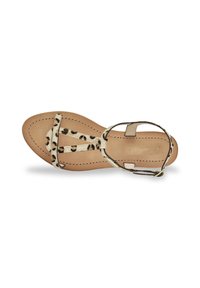 Lightweight beige sandal with leopard-print straps, flat sole, and adjustable ankle buckle. Features stitched detailing and smooth texture.