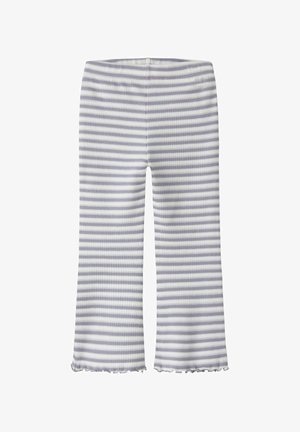 Legginsy w biało-fioletowe paski, z prążkowaną fakturą i rozkloszowanym krojem z falbanką na dole.